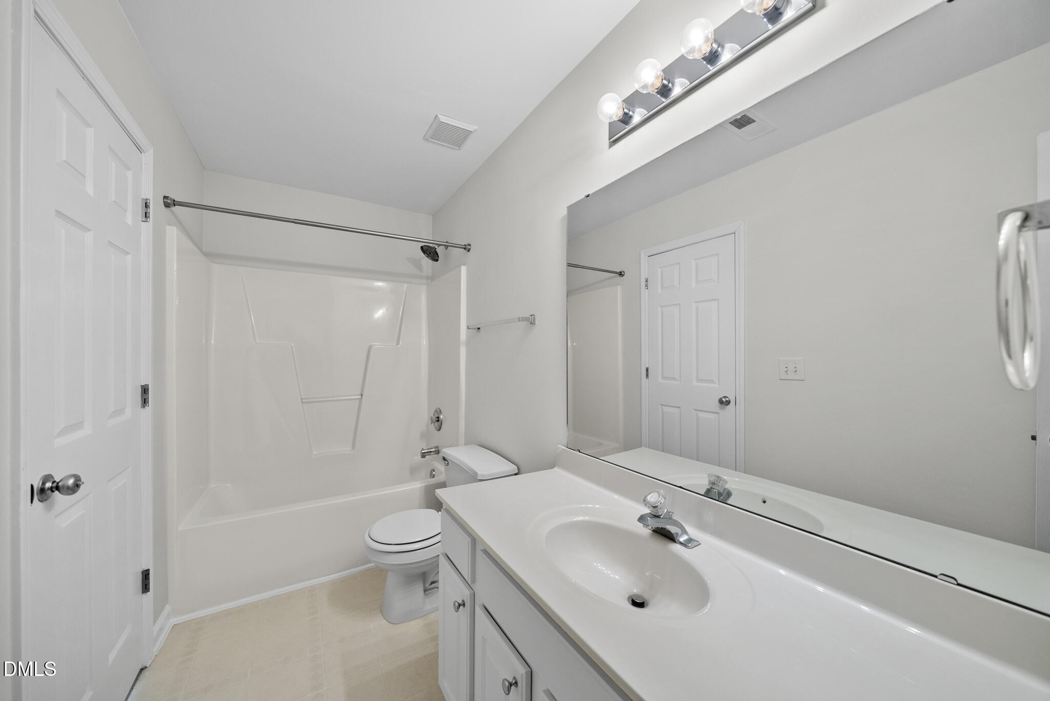 1024 Goldmist Lane Durham, NC 27713 - Photo 28 of 46 a bathroom with a sink a toilet and shower