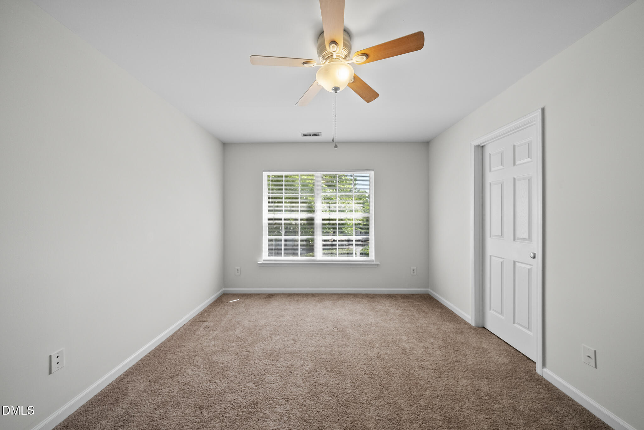 1024 Goldmist Lane Durham, NC 27713 - Photo 30 of 46 an empty room with a window and a fan