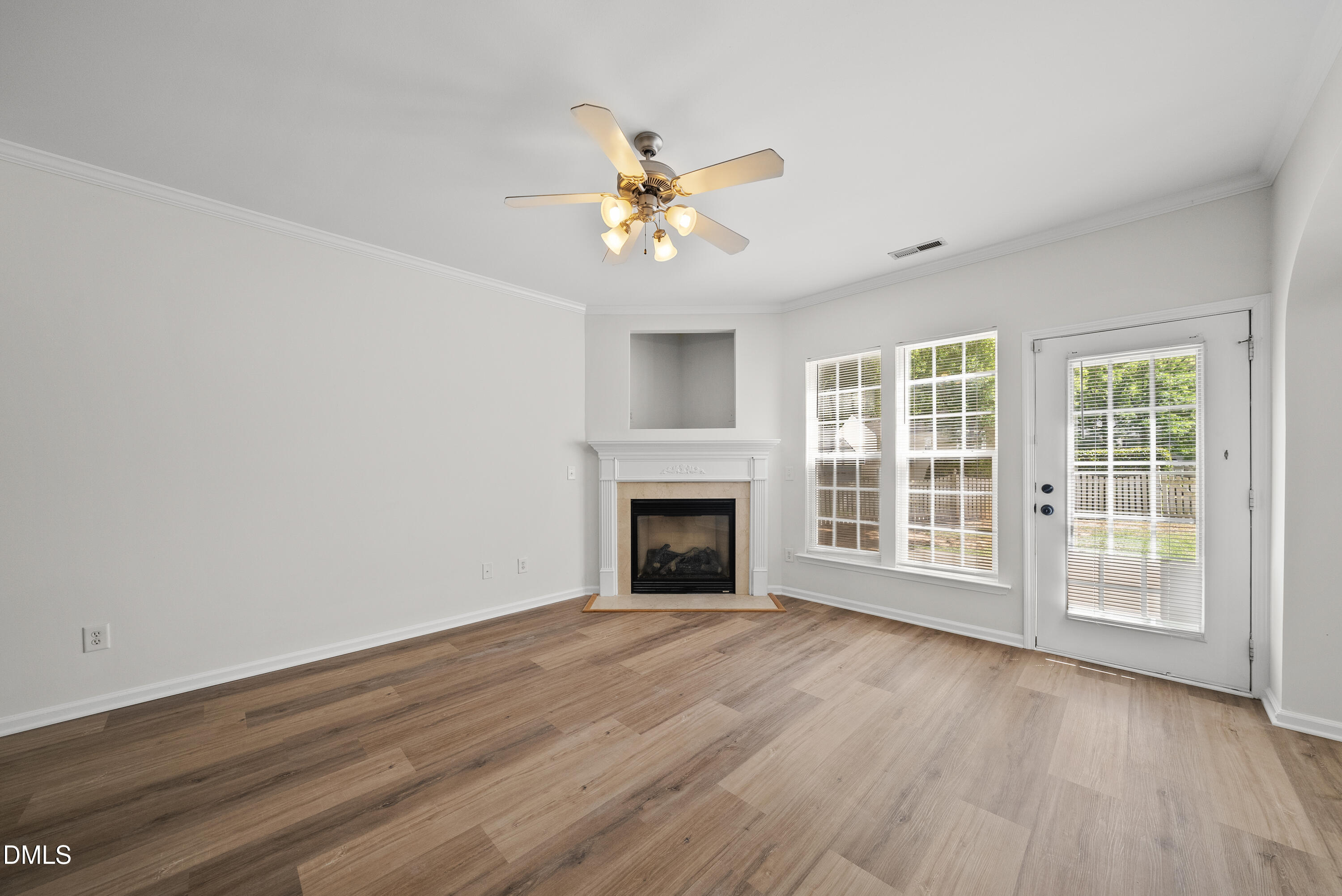 1024 Goldmist Lane Durham, NC 27713 - Photo 5 of 46 a view of a livingroom with wooden floor a ceiling fan and windows