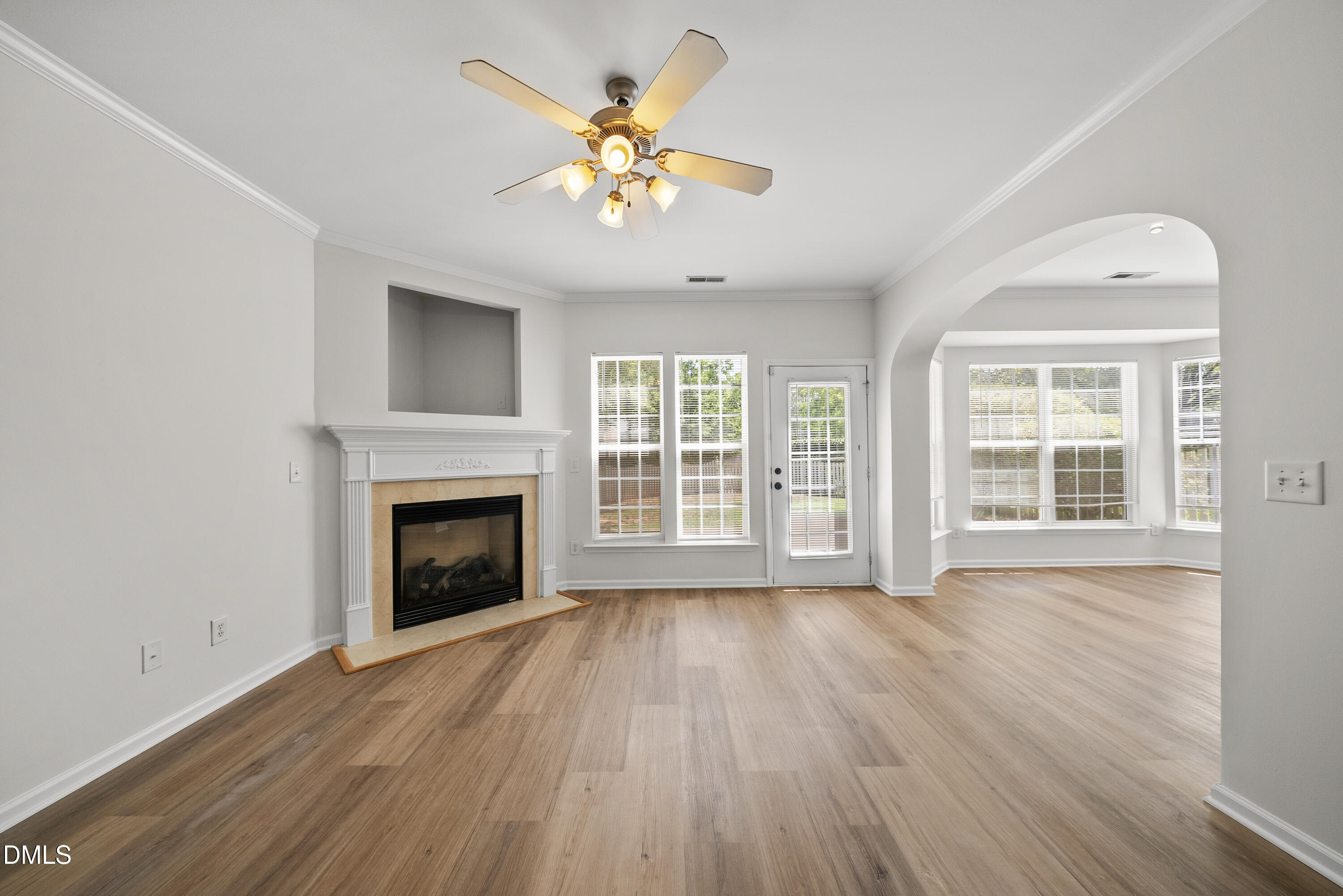 1024 Goldmist Lane Durham, NC 27713 - Photo 6 of 46 a view of an empty room with wooden floor and a window