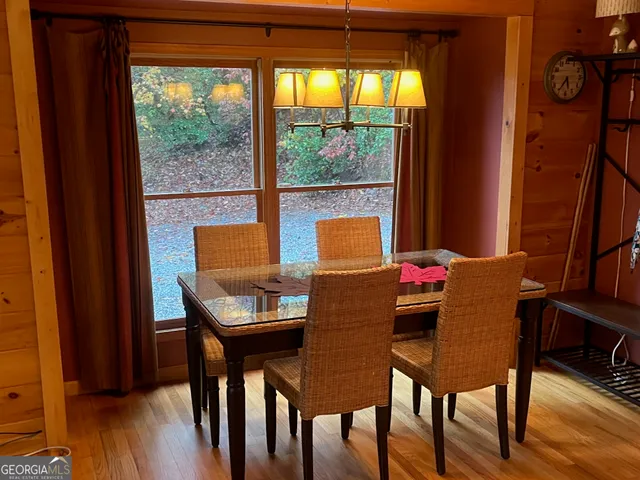 a outdoor dining space with furniture and wooden floor