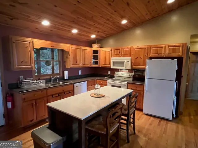 a kitchen with a table and chairs in it