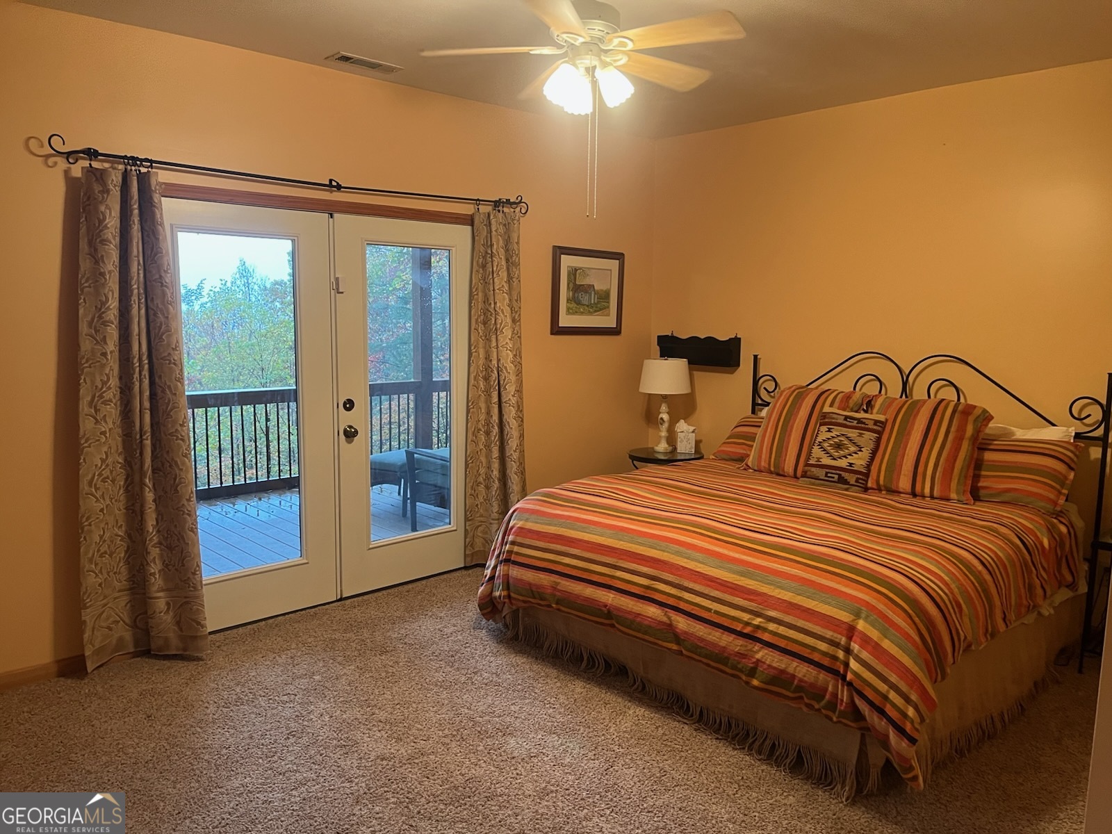 21 Switchback Drive Clayton, GA 30525 - Photo 10 of 15 a bedroom with a bed and a chandelier