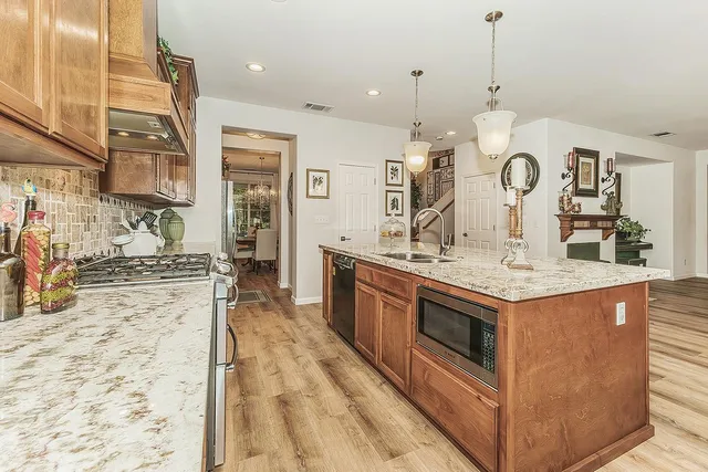 a bedroom with a bed and a potted plant