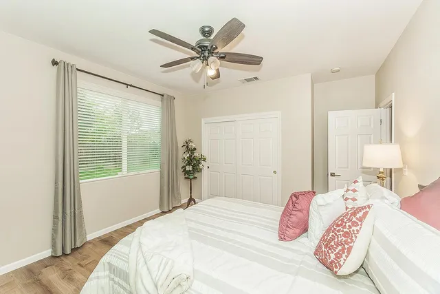 a bedroom with furniture and a chandelier