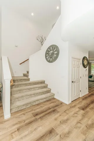 a bathroom with a sink double vanity granite tub shower and a mirror