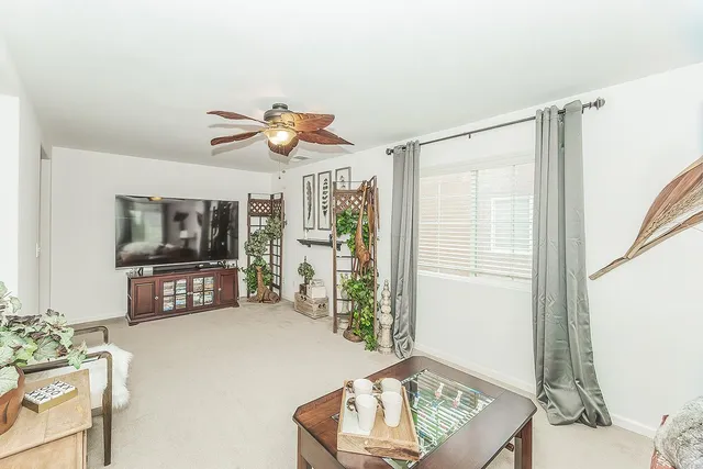 a spacious bathroom with a granite countertop sink a mirror and shower