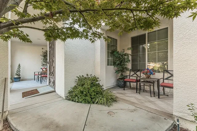 a living room with furniture and a clock