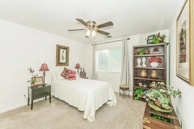 an aerial view of a house with a yard and sitting area