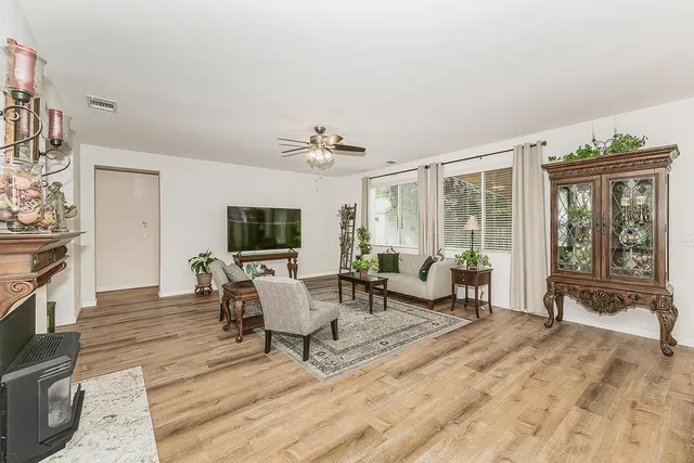 a kitchen with stainless steel appliances kitchen island granite countertop a stove and a sink
