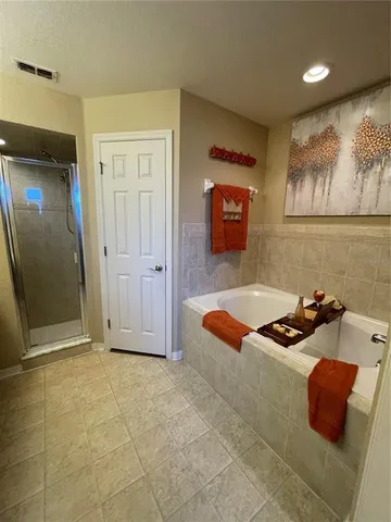 a room with furniture and wall paintings