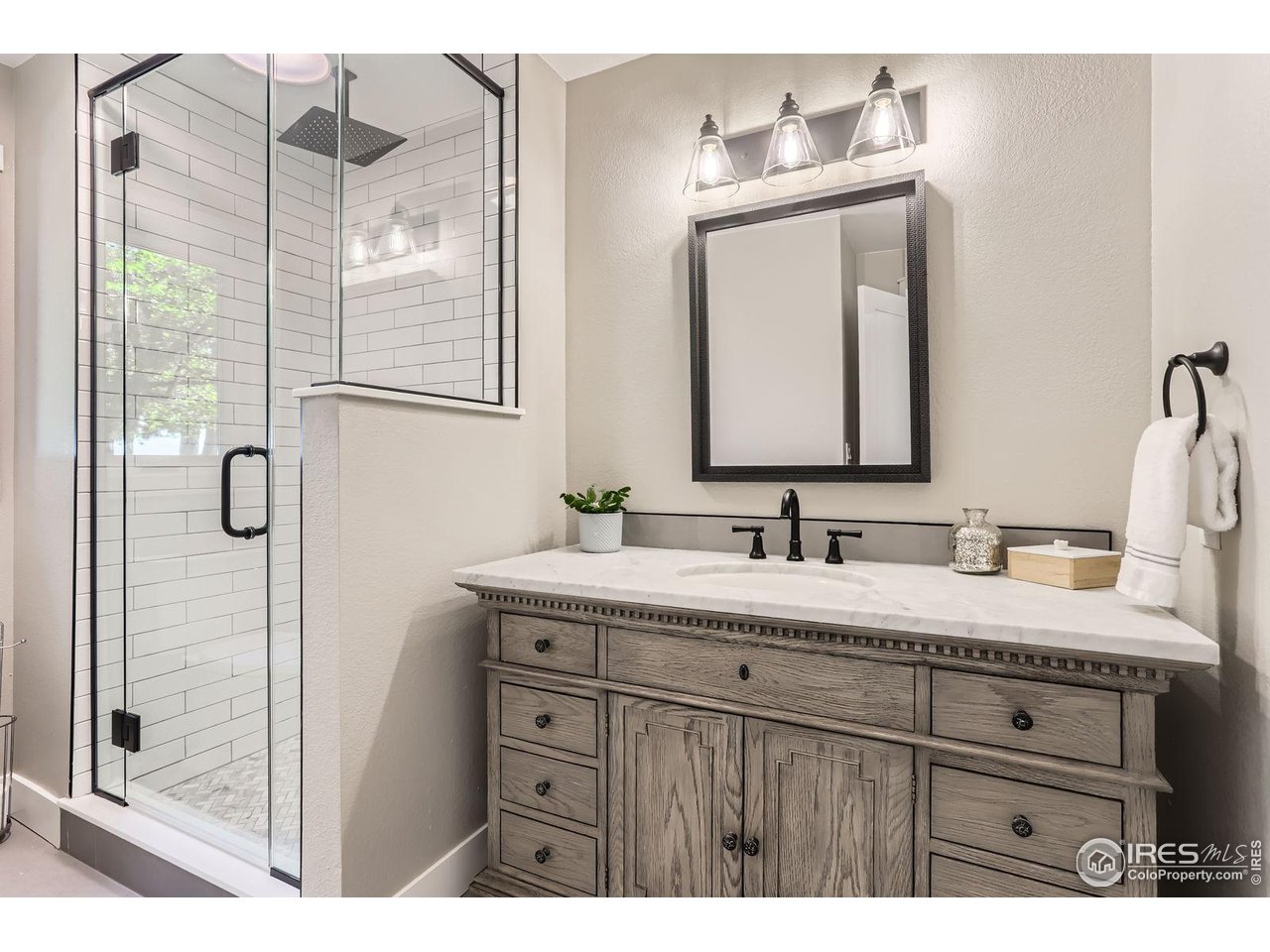 3159 Nelson Road Longmont, CO 80503 - Photo 27 of 40 Main floor bathroom just off mudroom and office