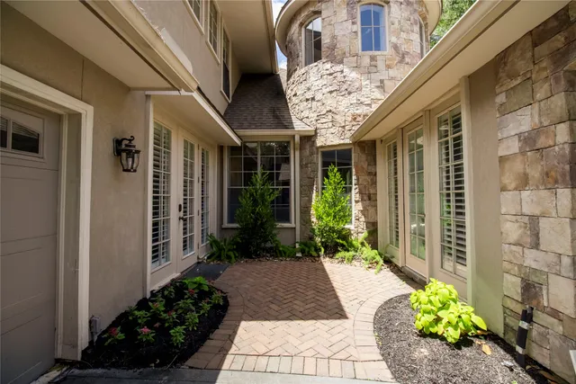 a view of a pathway with flower pots