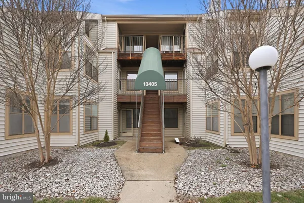 a front view of a house with parking space