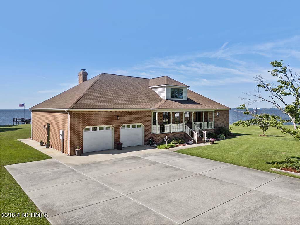 145 Ferry Dock Road Knotts Island, NC 27950 - Photo 13 of 79 The quality in design & construction is unmatched and look at the concrete parking pad.