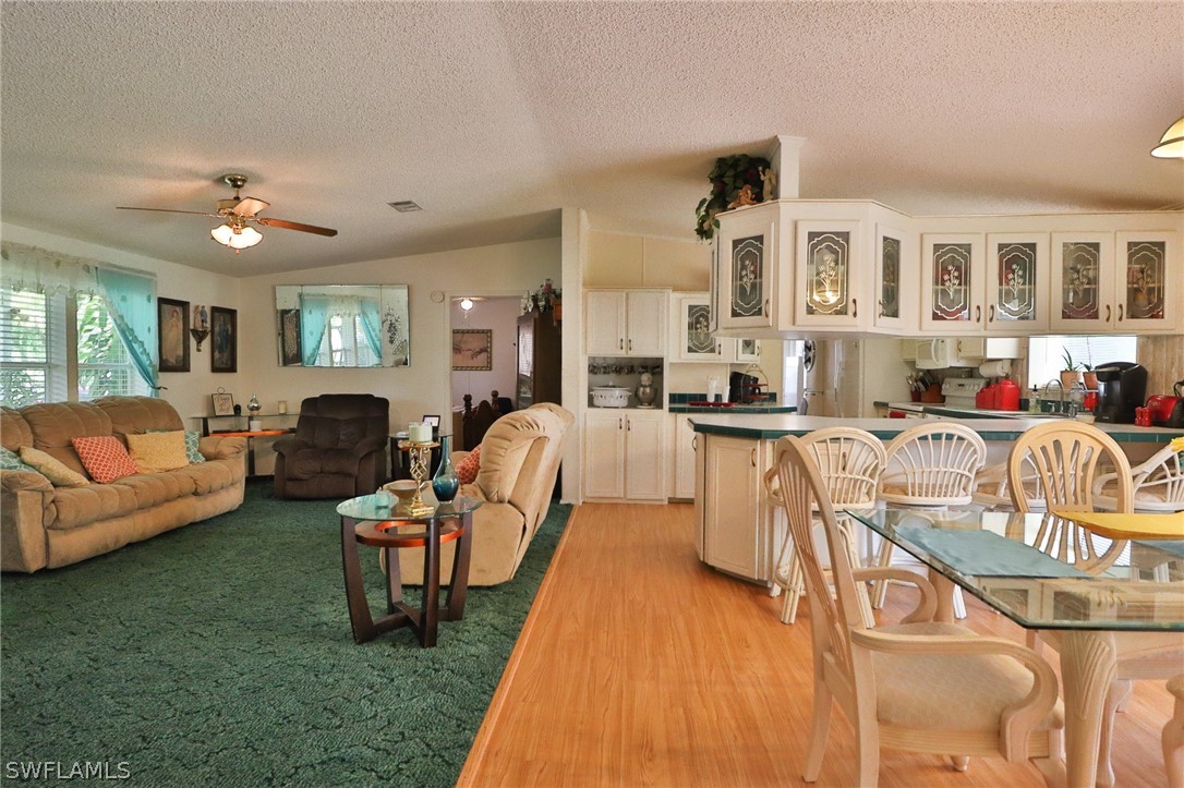 2671 Packinghouse Road Alva, FL 33920 - Photo 14 of 24 a living room with furniture fireplace and a table