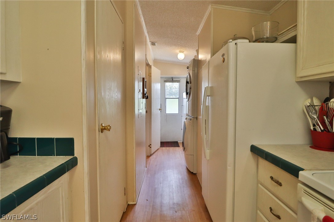 2671 Packinghouse Road Alva, FL 33920 - Photo 18 of 24 a view of a hallway with wooden floor