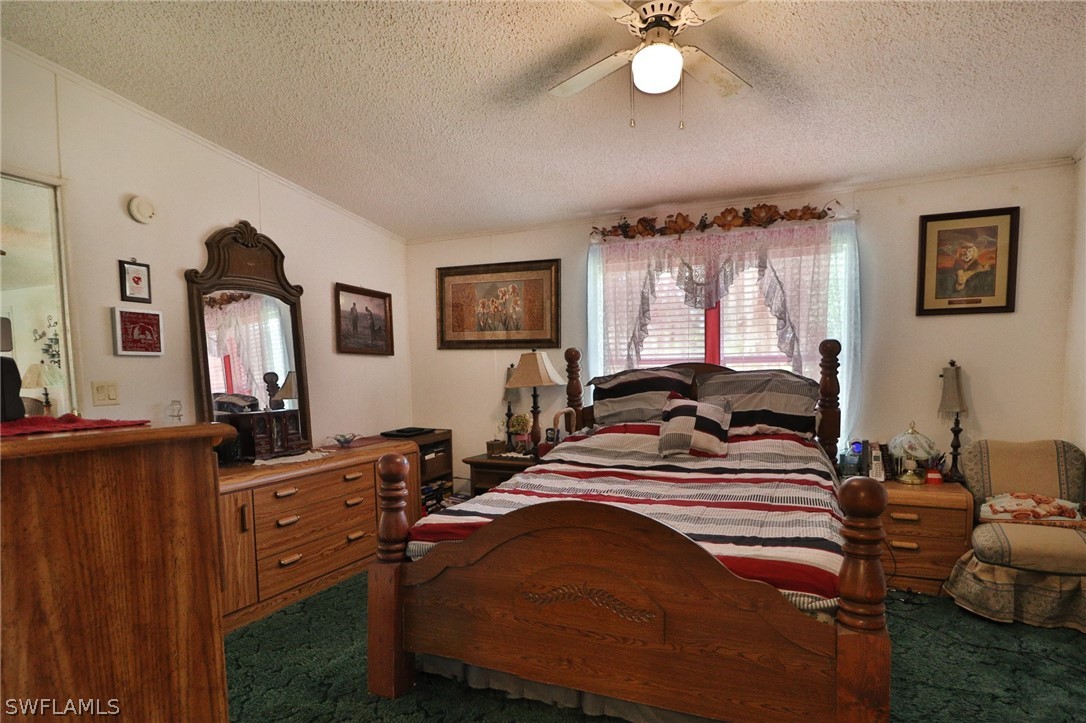 2671 Packinghouse Road Alva, FL 33920 - Photo 20 of 24 a bedroom with bed and window