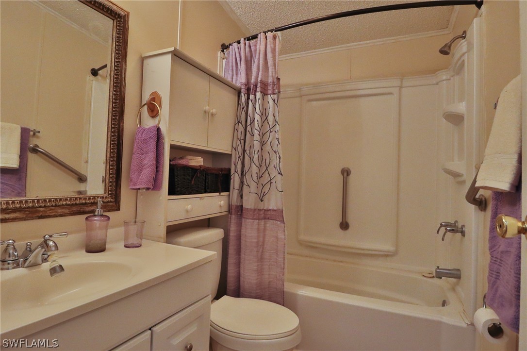 2671 Packinghouse Road Alva, FL 33920 - Photo 23 of 24 a bathroom with a sink a toilet and shower