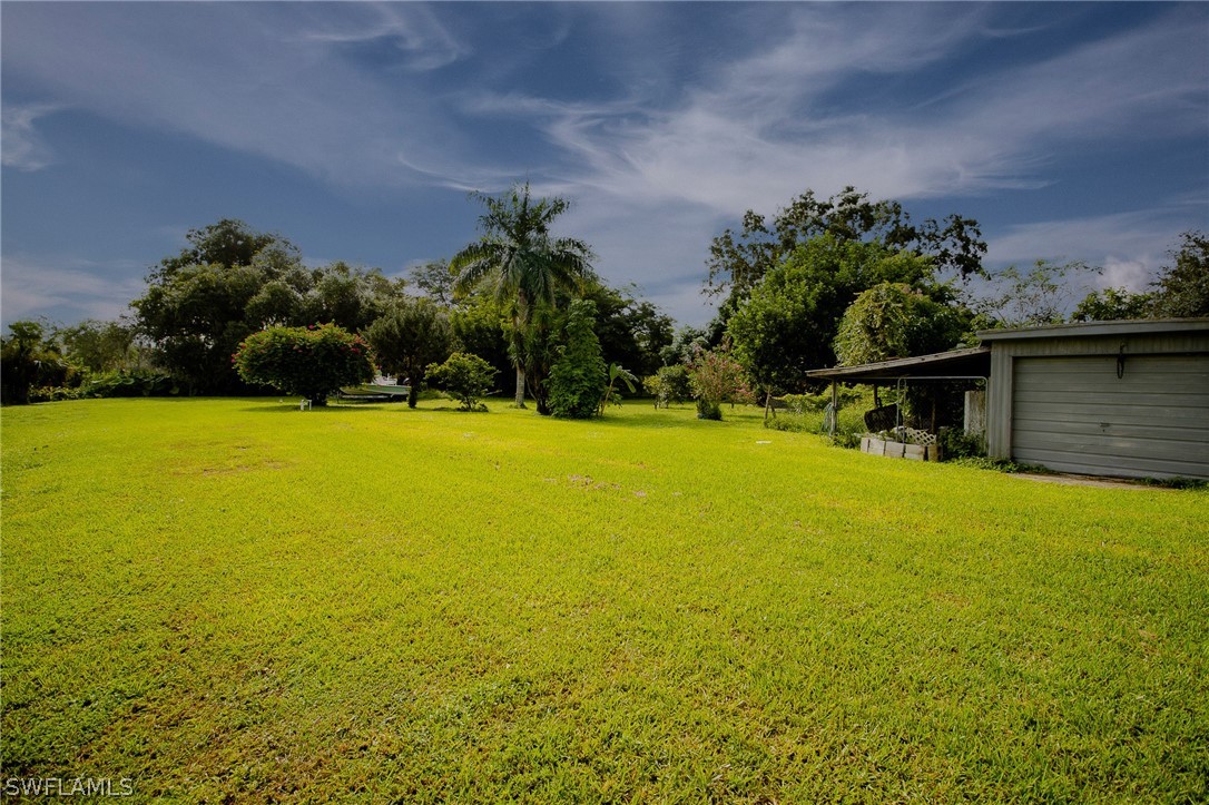 2671 Packinghouse Road Alva, FL 33920 - Photo 8 of 24 a view of a swimming pool and an outdoor space