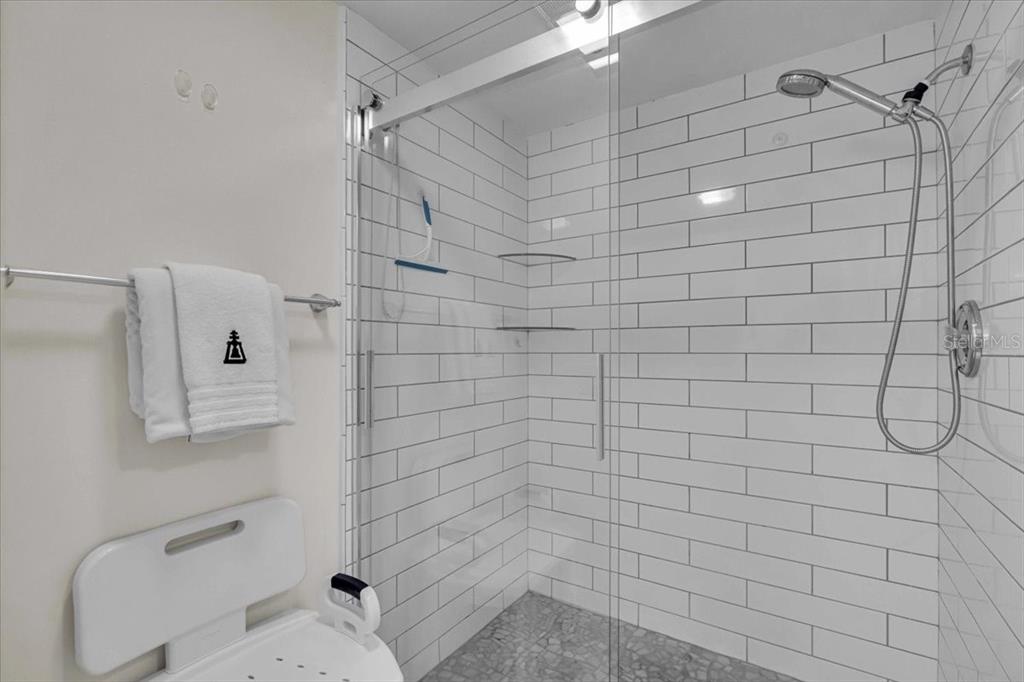 5621 Gulf Of Mexico Drive, Unit 102 Longboat Key, FL 34228 - Photo 17 of 22 a bathroom with a shower