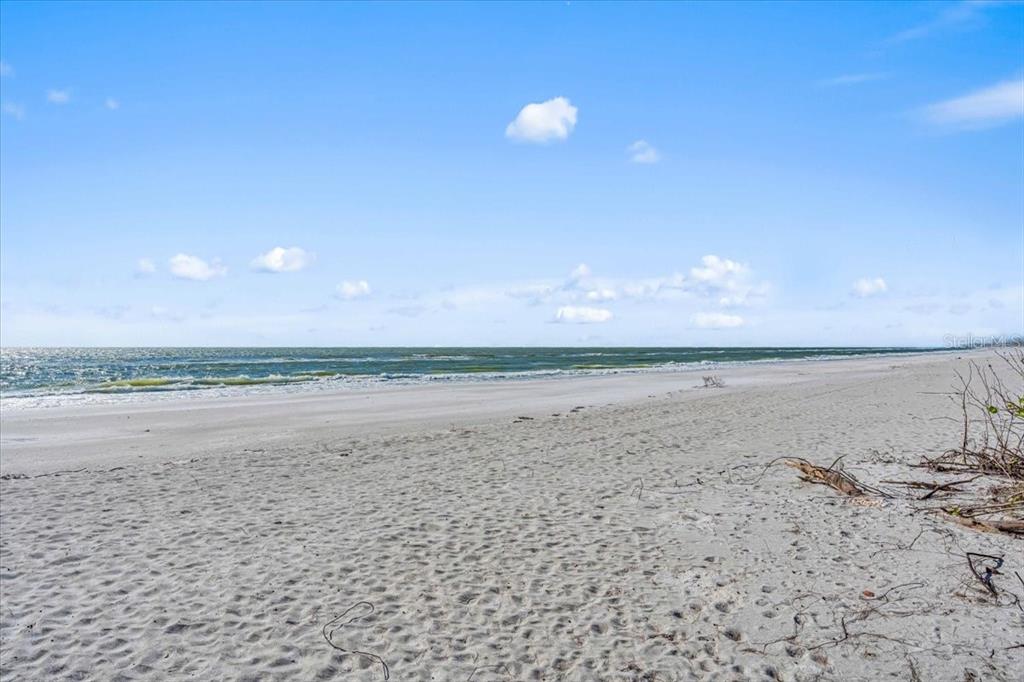 5621 Gulf Of Mexico Drive, Unit 102 Longboat Key, FL 34228 - Photo 22 of 22 a view of ocean view with beach