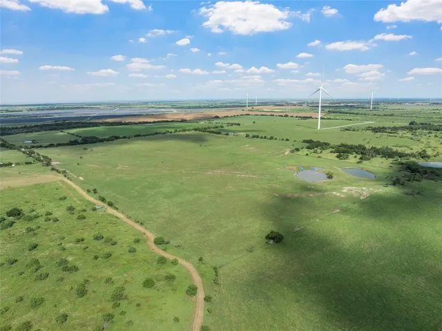 a view of an ocean and a yard