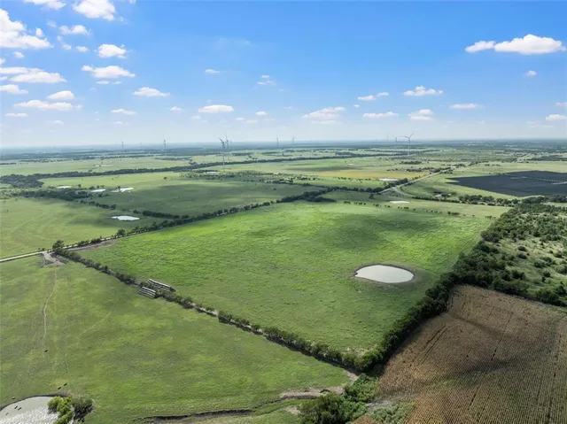 a view of a lake with a big yard