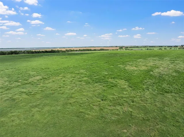 a view of a lake with a big yard