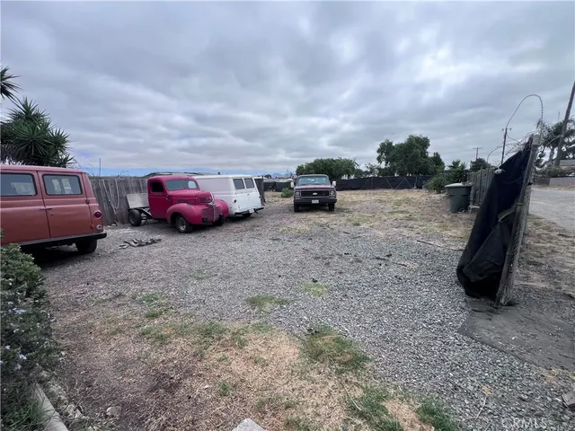 a view of a backyard with a car parked in it