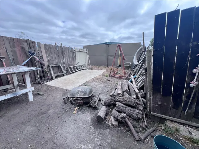 a view of roof deck with wooden fence