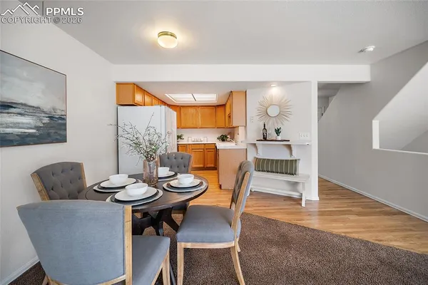 a view of a dining room with furniture and wooden floor