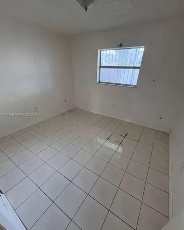 a view of a livingroom and entryway