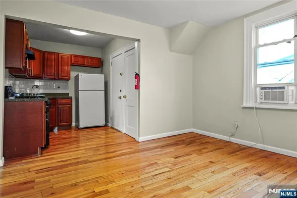 a view of kitchen with wooden floor