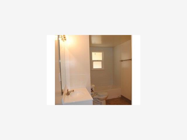 43 Miller Road Watsonville, CA 95076 - Photo 4 of 9 a picture of a bathroom with a sink and mirror