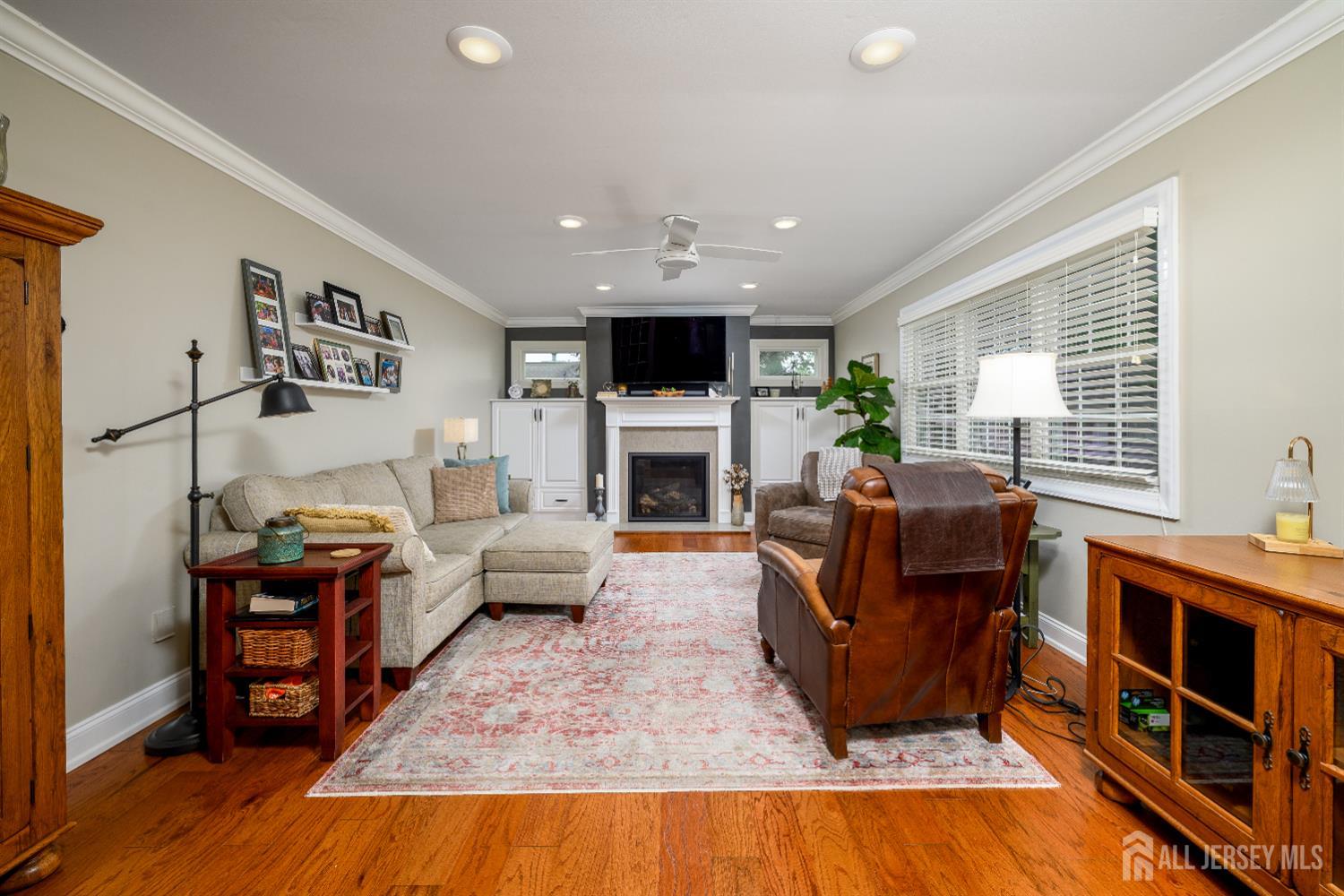 7 Manor Court Old Bridge, NJ 08857 - Photo 19 of 46 a living room with furniture fireplace and flat screen tv