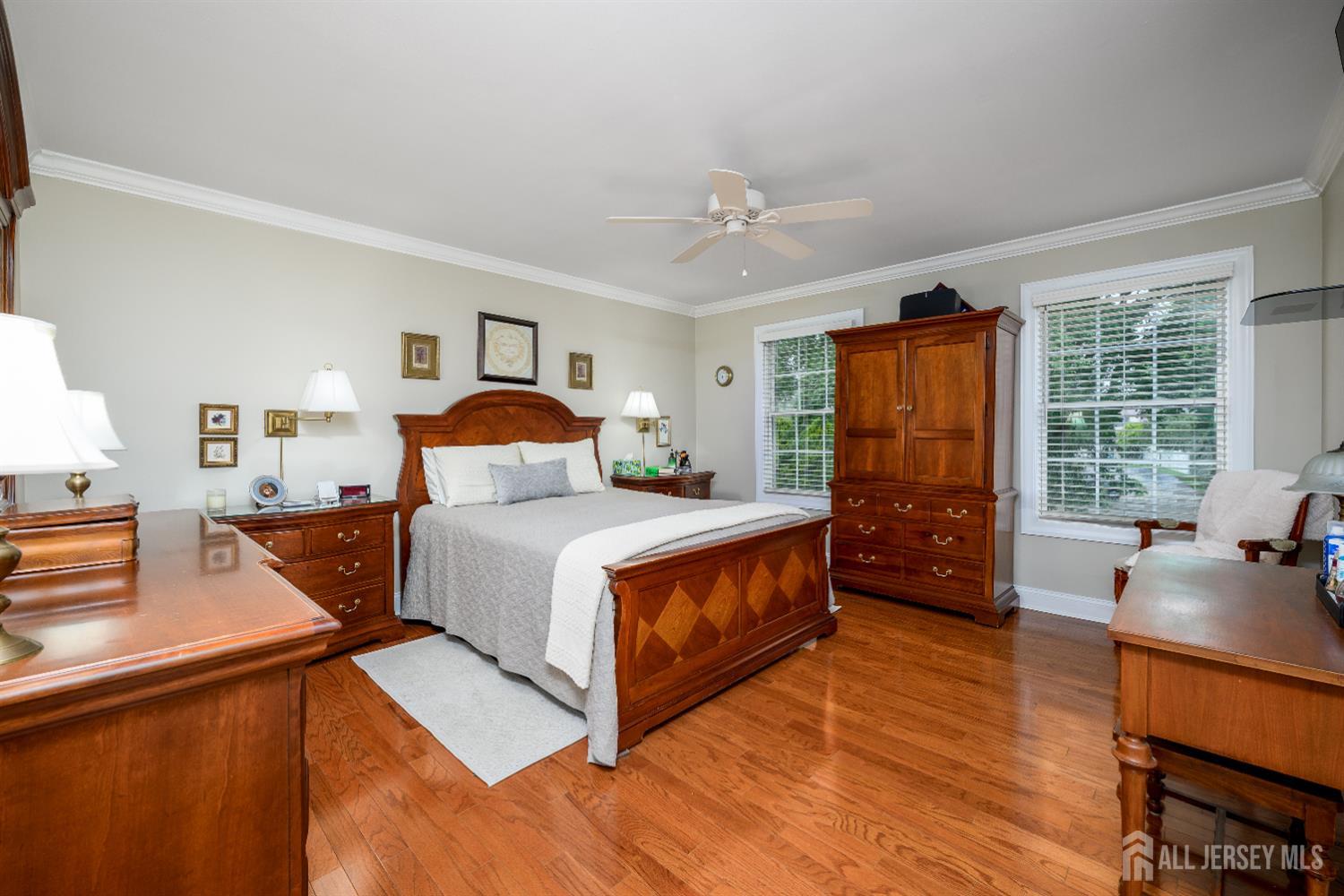 7 Manor Court Old Bridge, NJ 08857 - Photo 22 of 46 a bedroom with a bed and wooden floor