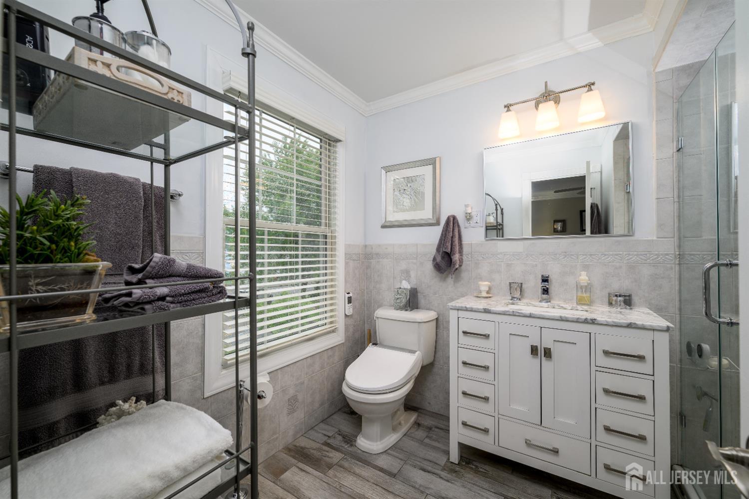 7 Manor Court Old Bridge, NJ 08857 - Photo 26 of 46 a bathroom with a toilet a sink and a mirror