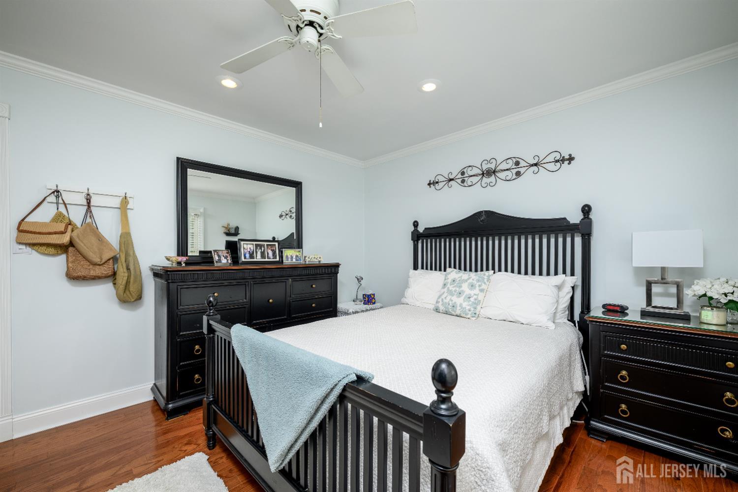 7 Manor Court Old Bridge, NJ 08857 - Photo 29 of 46 a bedroom with a bed and wooden floor