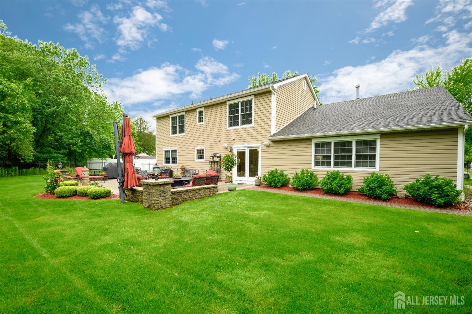 7 Manor Court Old Bridge, NJ 08857 - Photo 38 of 46 a backyard of a house with table and chairs