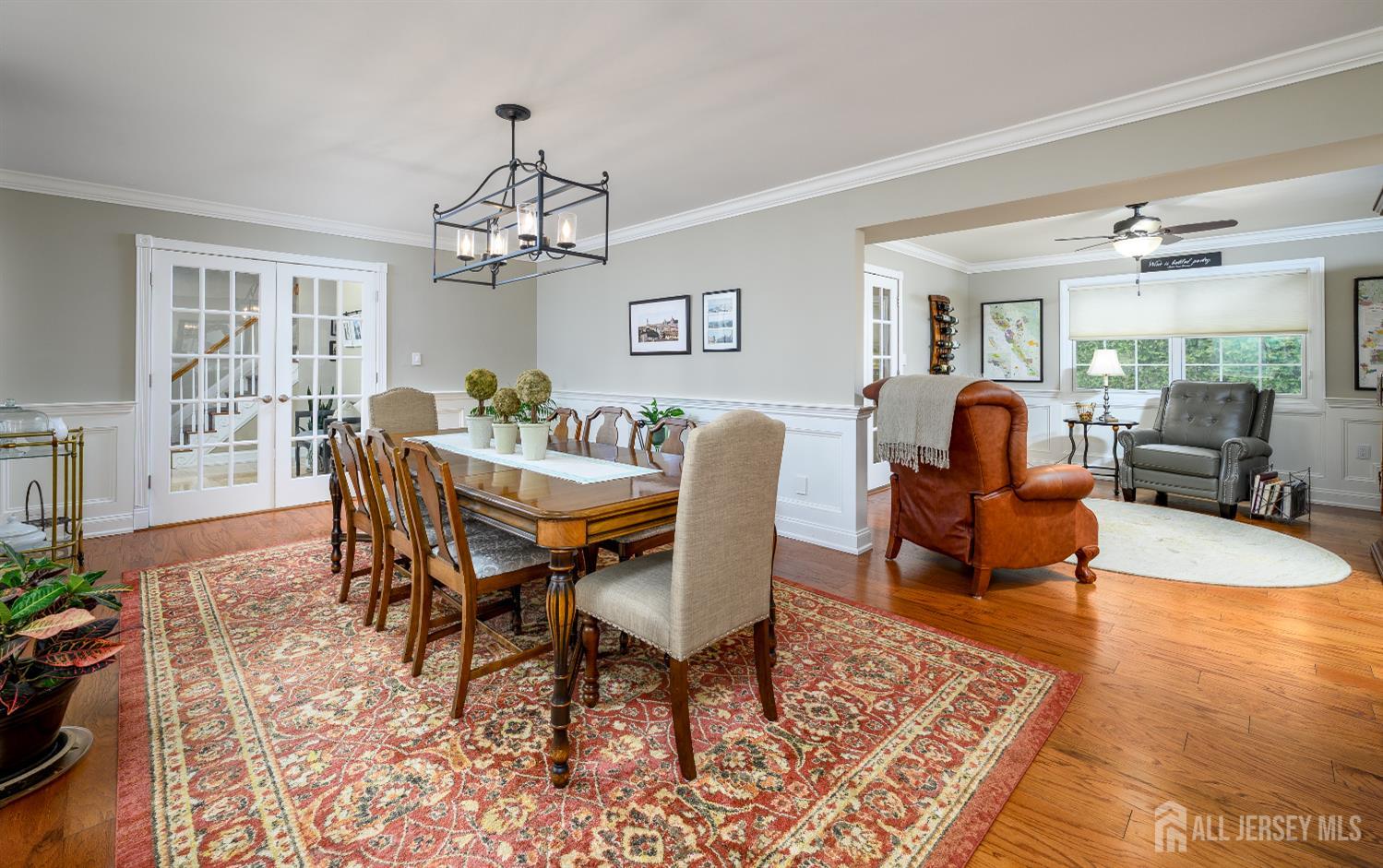 7 Manor Court Old Bridge, NJ 08857 - Photo 10 of 46 a dining room with wooden floor a chandelier a wooden table and chairs