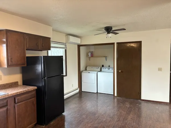 a kitchen with a refrigerator a sink and dishwasher