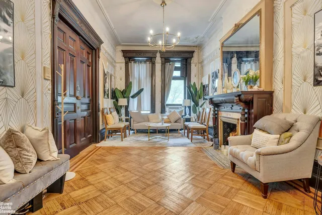 a living room with furniture and large windows