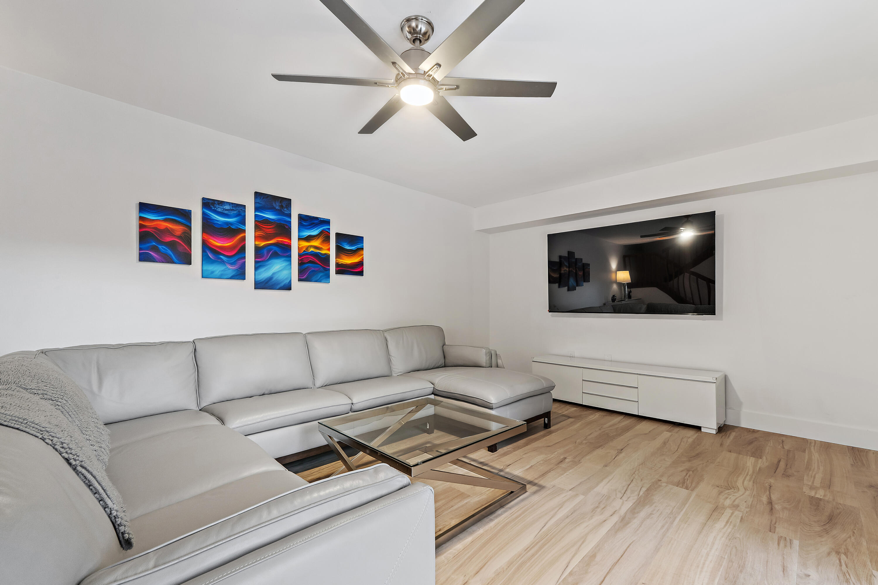 3052 30th Court Jupiter, FL 33477 - Photo 13 of 45 a living room with furniture and a flat screen tv