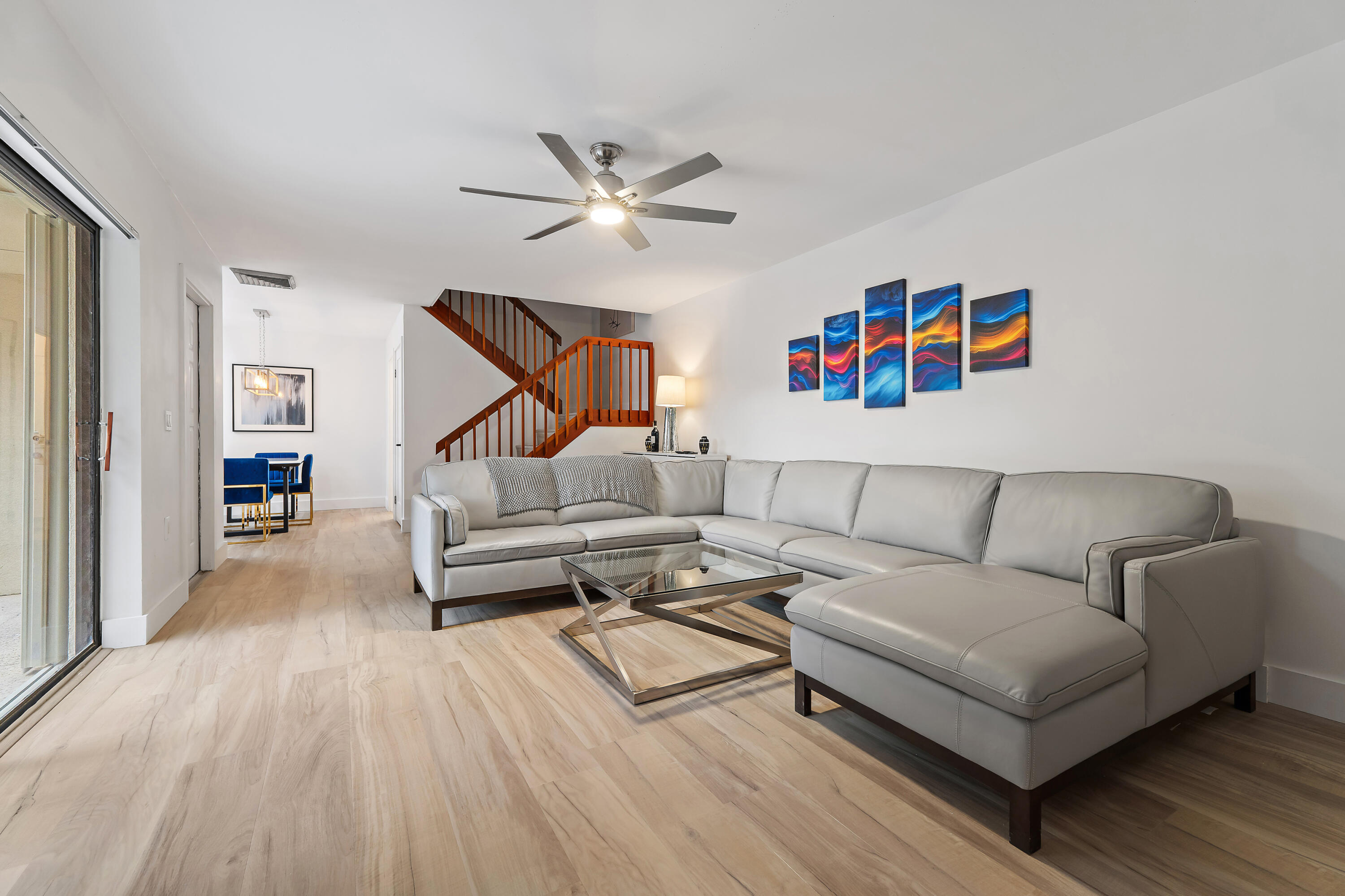 3052 30th Court Jupiter, FL 33477 - Photo 14 of 45 a living room with furniture and a wooden floor