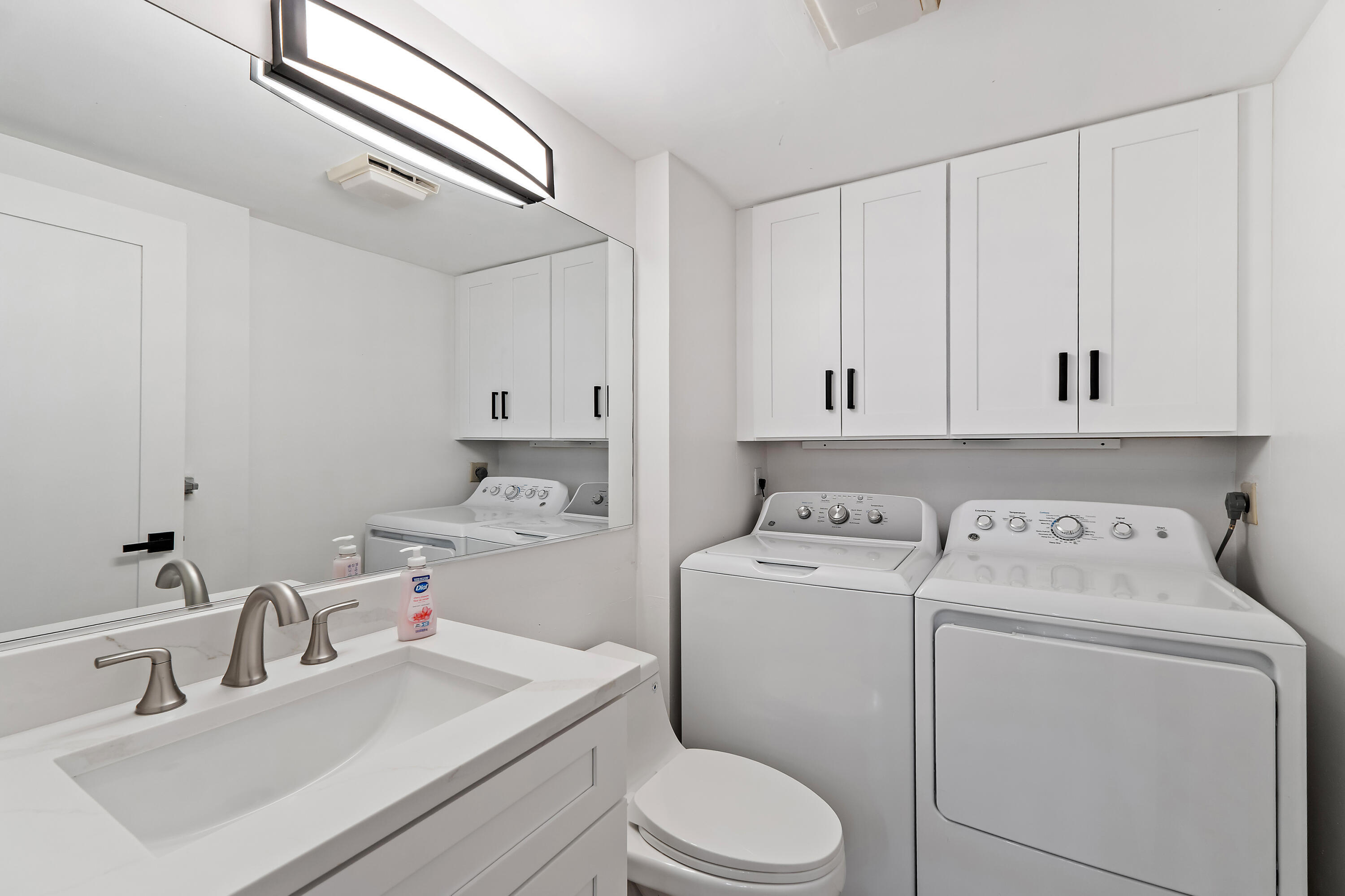 3052 30th Court Jupiter, FL 33477 - Photo 19 of 45 a utility room with dryer and washer