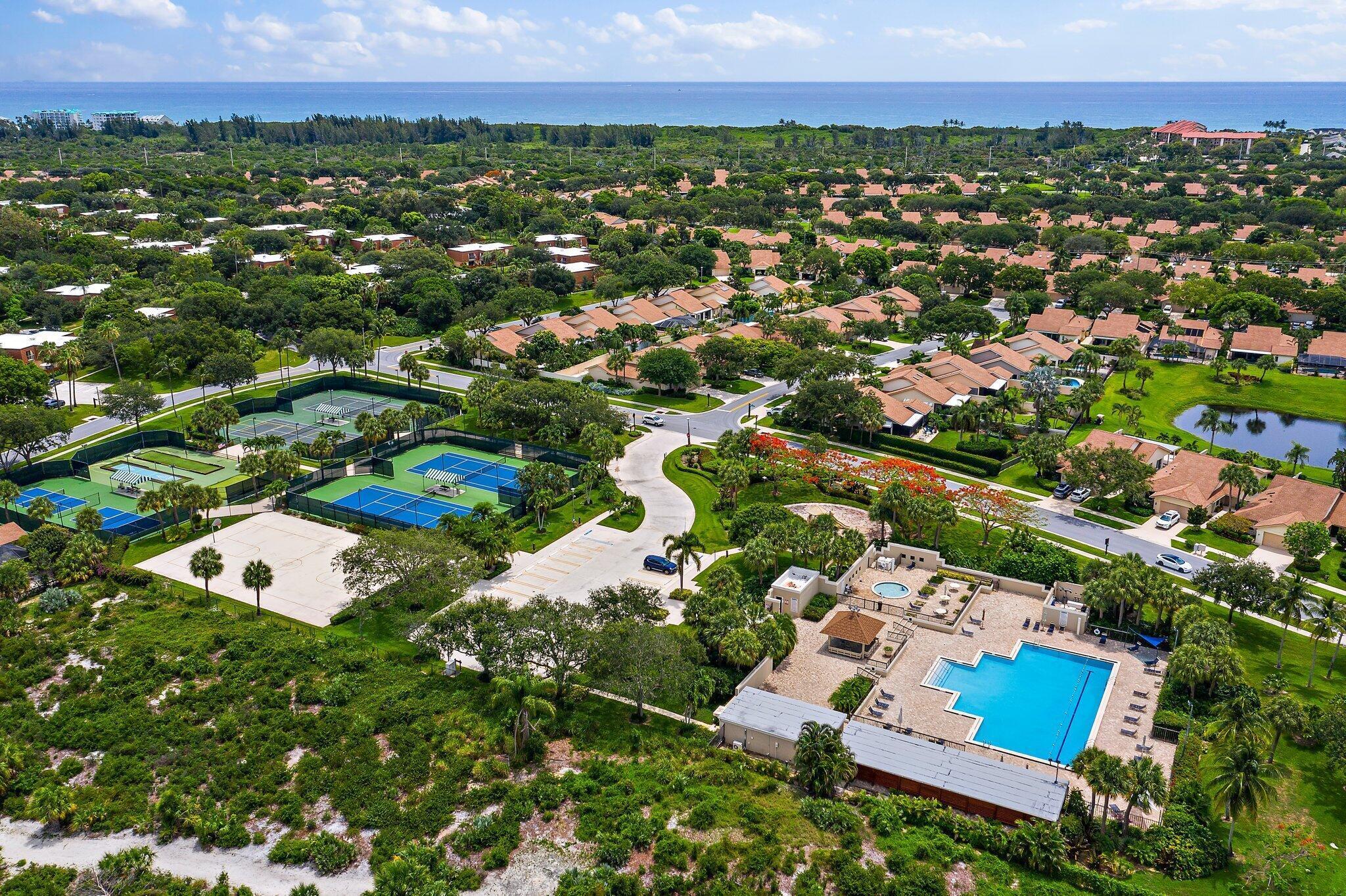 3052 30th Court Jupiter, FL 33477 - Photo 2 of 45 an aerial view of residential houses with outdoor space