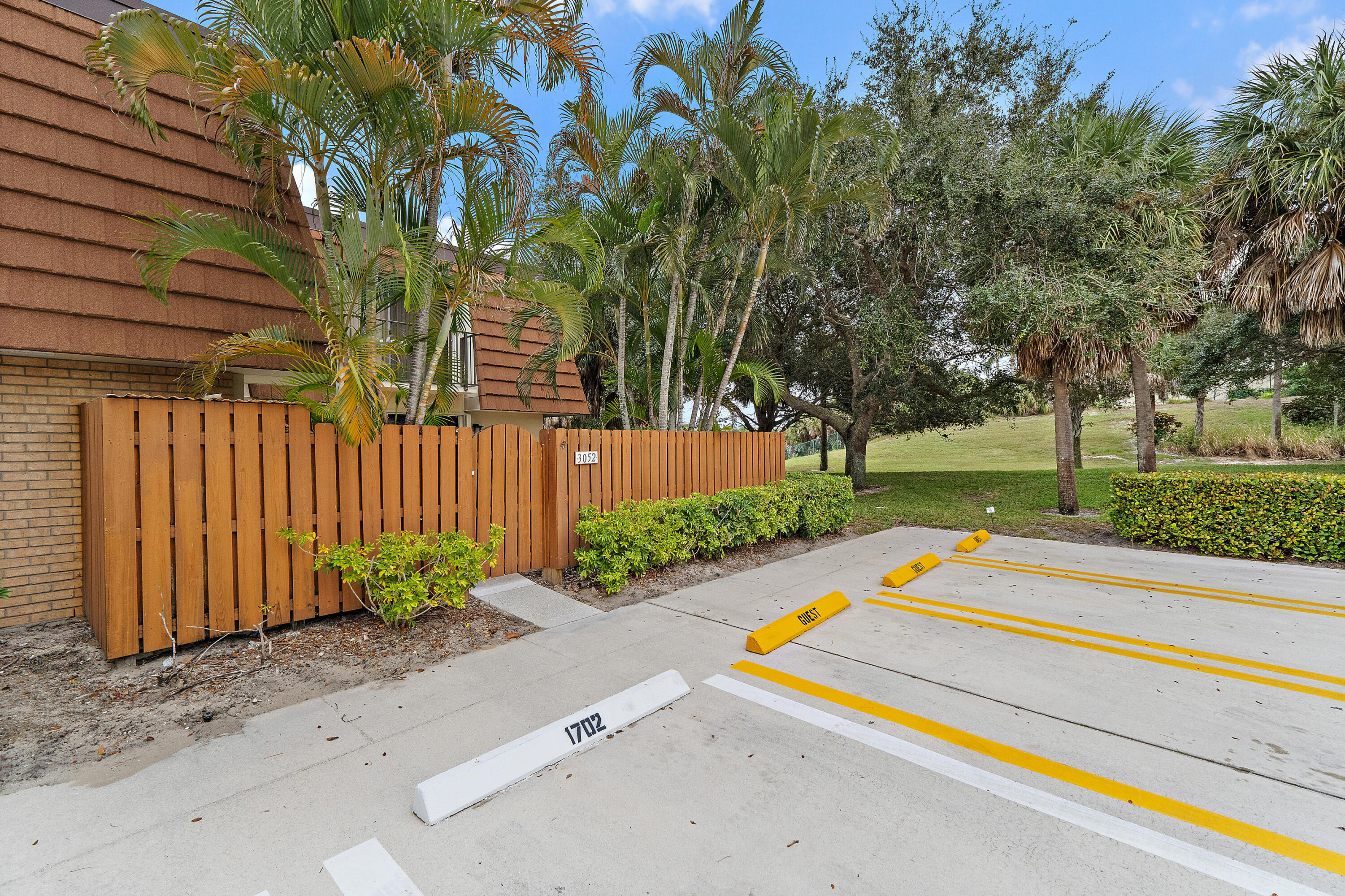 3052 30th Court Jupiter, FL 33477 - Photo 3 of 45 a garden view with a seating space