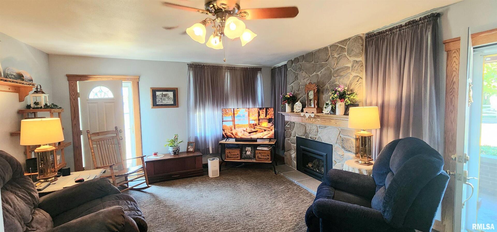 2412 State Street Chester, IL 62233 - Photo 5 of 11 a living room with furniture and a fireplace