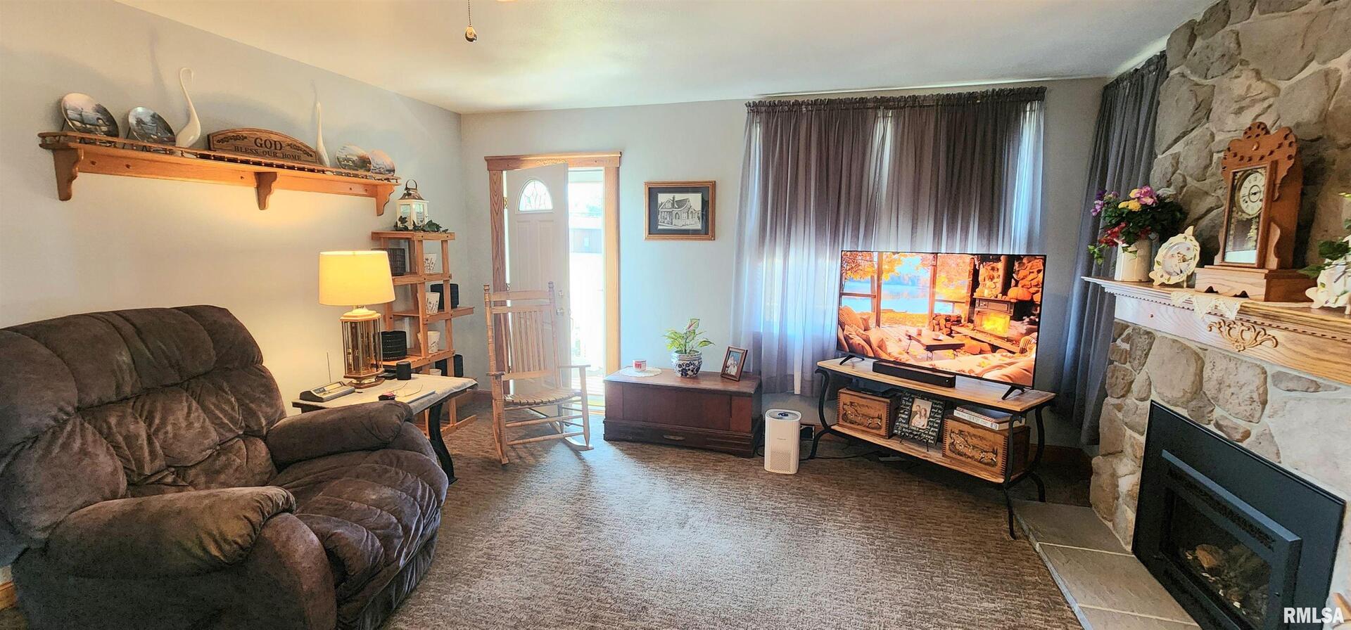 2412 State Street Chester, IL 62233 - Photo 6 of 11 a living room with furniture and a flat screen tv